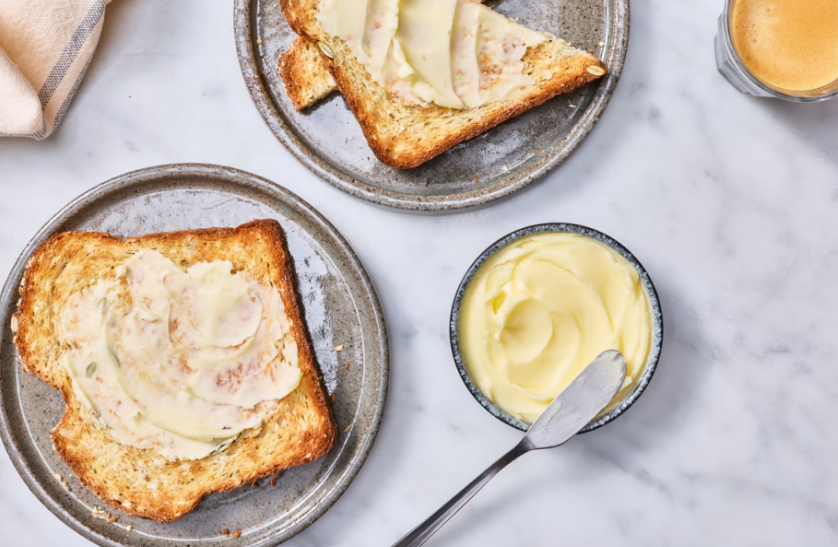 Toast with homemade butter and a bowl of creamy butter